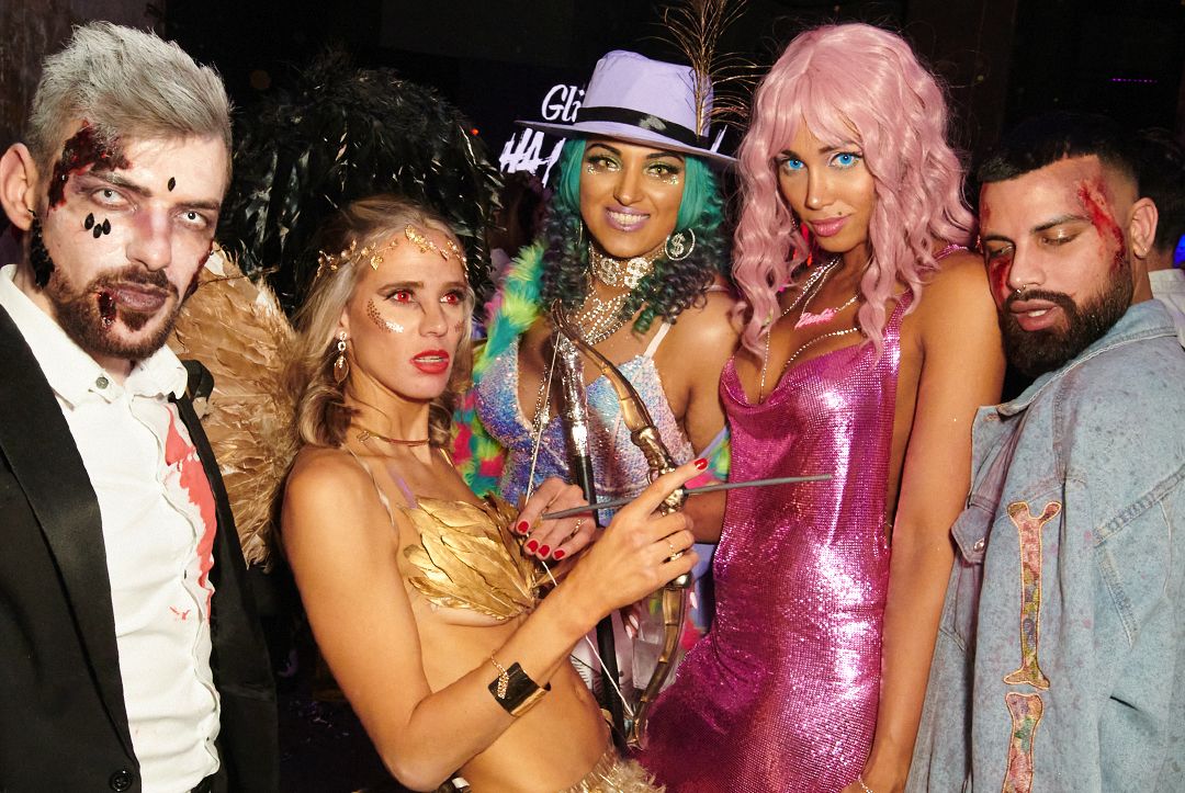 Photo of people dress up in amazing Halloween costumes at Glitterfest